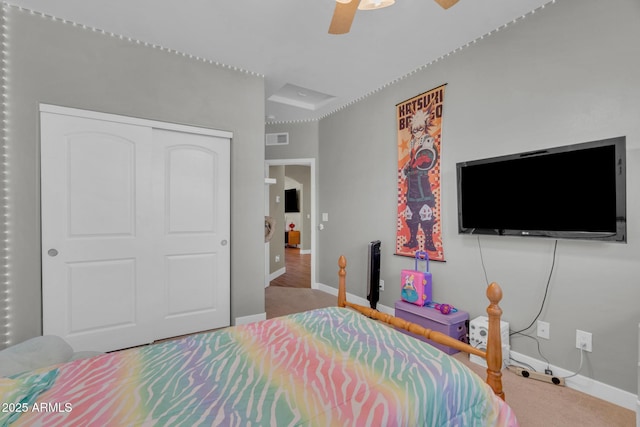 bedroom with a closet, visible vents, baseboards, and a ceiling fan