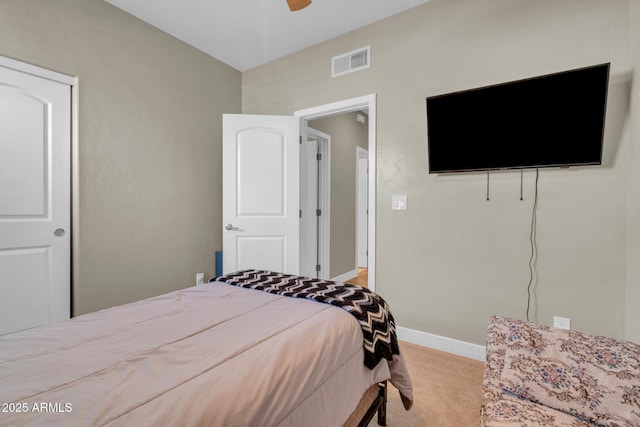 bedroom with carpet, visible vents, baseboards, and a ceiling fan