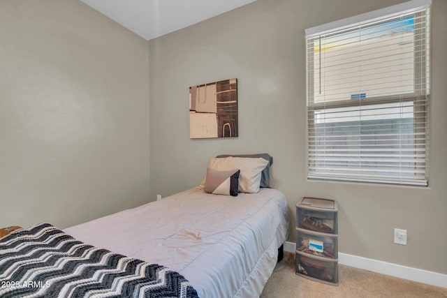 carpeted bedroom with baseboards
