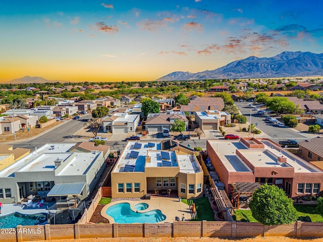 drone / aerial view with a residential view and a mountain view