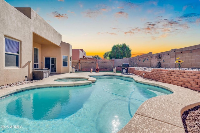 view of pool featuring a fenced backyard, an in ground hot tub, a patio, and a fenced in pool