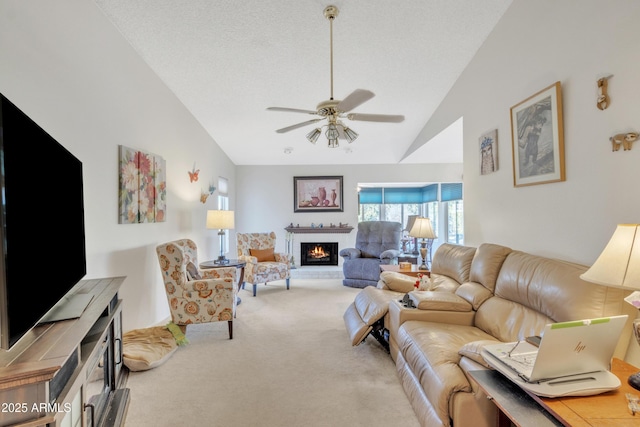 living room with light carpet, a textured ceiling, vaulted ceiling, and ceiling fan