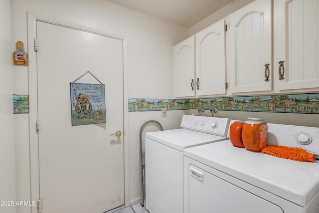 laundry room featuring cabinets and separate washer and dryer