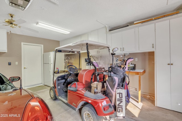 garage with ceiling fan and white refrigerator