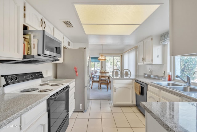 kitchen with pendant lighting, sink, white cabinetry, stainless steel appliances, and a healthy amount of sunlight