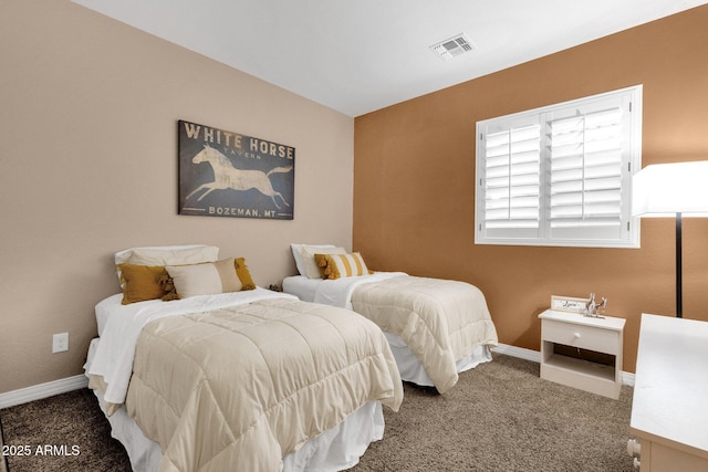 carpeted bedroom with visible vents and baseboards