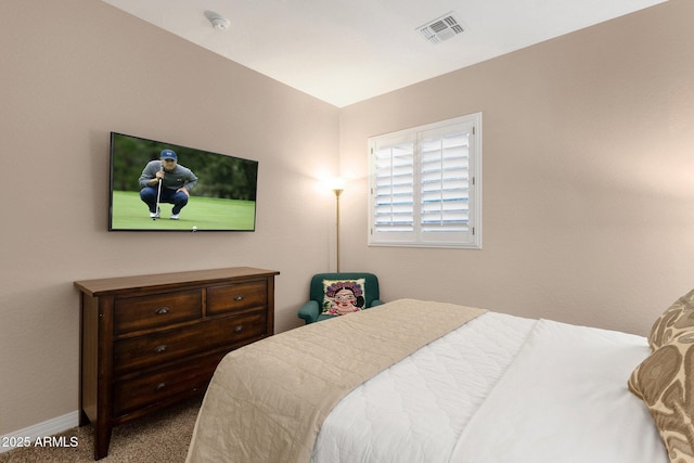 bedroom with baseboards, visible vents, and carpet flooring