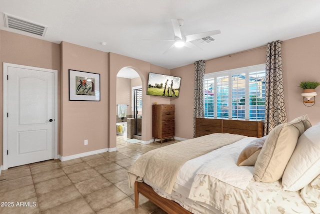 bedroom with arched walkways, visible vents, ceiling fan, and baseboards