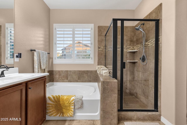 full bath with a shower stall, vanity, and a bath