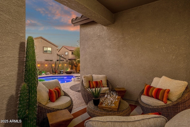 view of patio featuring outdoor lounge area, a fenced backyard, and a fenced in pool