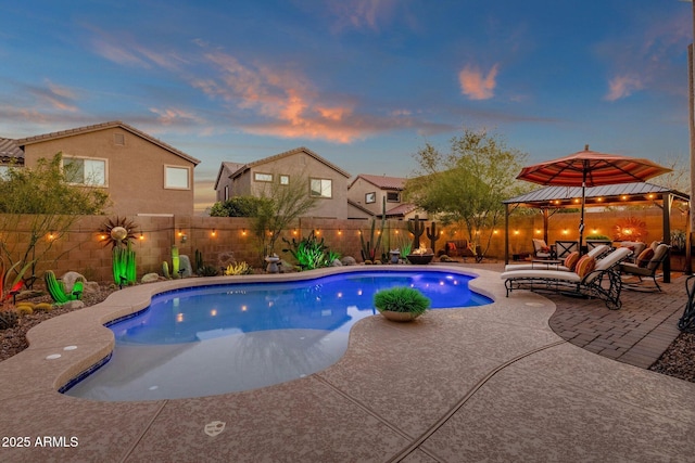 view of swimming pool with a fenced in pool, a patio, a gazebo, a fenced backyard, and an outdoor living space