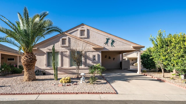 view of front of property with a carport