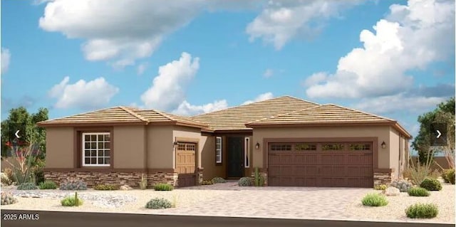 20146 W Monterey Way, Buckeye, AZ 85396 - view of front of house with stone siding, a garage, and stucco siding