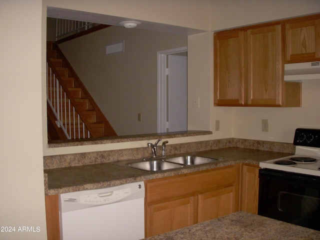 kitchen featuring white appliances and sink