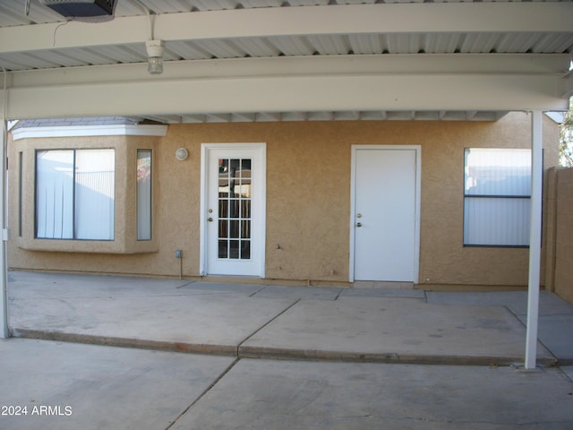 entrance to property with a patio area