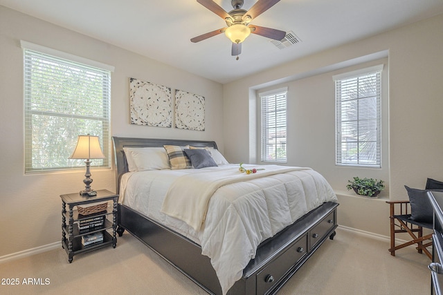 bedroom featuring light carpet, baseboards, and visible vents