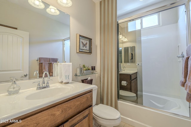 bathroom with vanity, toilet, and shower / bathtub combination