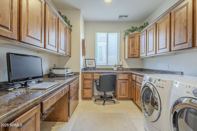 clothes washing area featuring visible vents, independent washer and dryer, and light tile patterned flooring