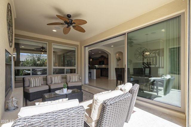 view of patio with outdoor lounge area and a ceiling fan