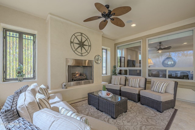 living area with a high end fireplace and tile patterned floors