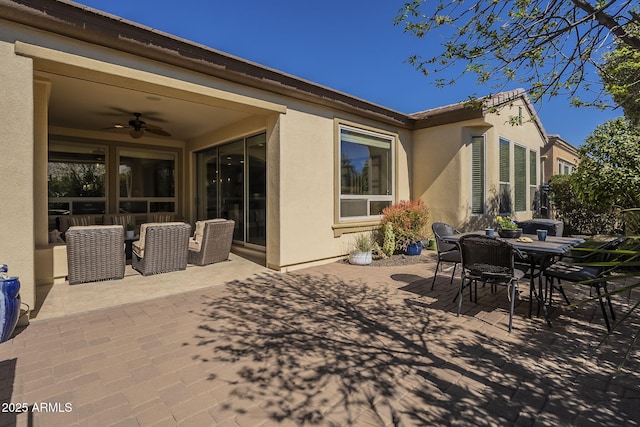 view of patio / terrace with outdoor dining space and ceiling fan