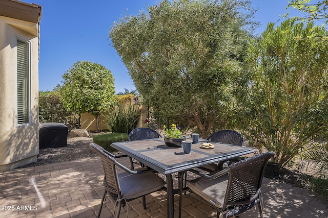 view of patio / terrace featuring outdoor dining space and fence