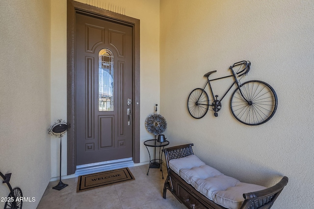 entrance to property with stucco siding