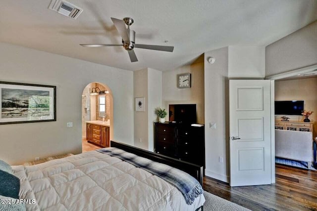 3935 E Rough Rider Rd Unit 1360, Phoenix, AZ 85050 - bedroom featuring arched walkways, wood finished floors, and ceiling fan