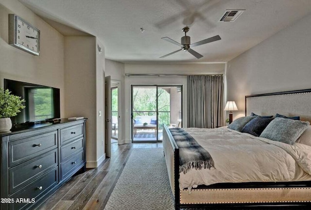 3935 E Rough Rider Rd Unit 1360, Phoenix, AZ 85050 - bedroom with dark wood-type flooring, access to outside, baseboards, and a ceiling fan