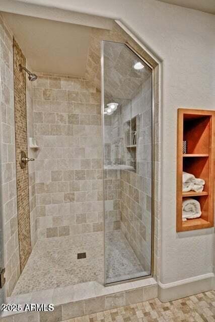 3935 E Rough Rider Rd Unit 1360, Phoenix, AZ 85050 - full bath featuring a stall shower and baseboards