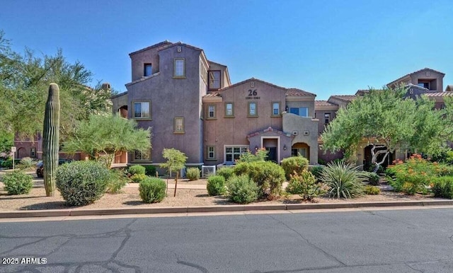 3935 E Rough Rider Rd Unit 1360, Phoenix, AZ 85050 - view of front of house featuring stucco siding