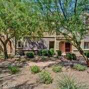3935 E Rough Rider Rd Unit 1360, Phoenix, AZ 85050 - view of property hidden behind natural elements