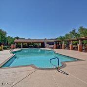 3935 E Rough Rider Rd Unit 1360, Phoenix, AZ 85050 - community pool featuring a patio