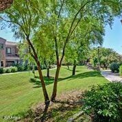 3935 E Rough Rider Rd Unit 1360, Phoenix, AZ 85050 - view of property's community featuring a lawn