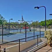 3935 E Rough Rider Rd Unit 1360, Phoenix, AZ 85050 - view of tennis court featuring fence