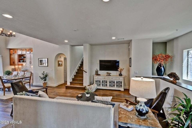 3935 E Rough Rider Rd Unit 1360, Phoenix, AZ 85050 - living area featuring recessed lighting, arched walkways, wood finished floors, baseboards, and stairs