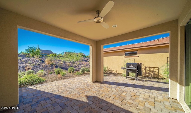 view of patio featuring a ceiling fan