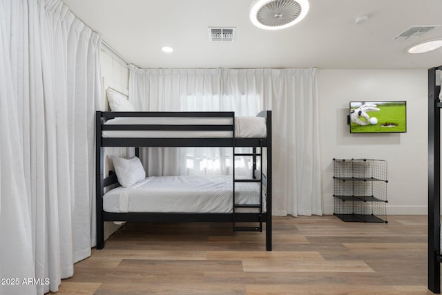 bedroom featuring wood-type flooring