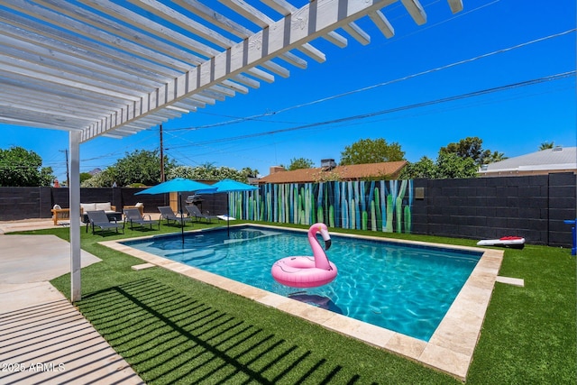 view of pool with a yard, a patio area, and a pergola