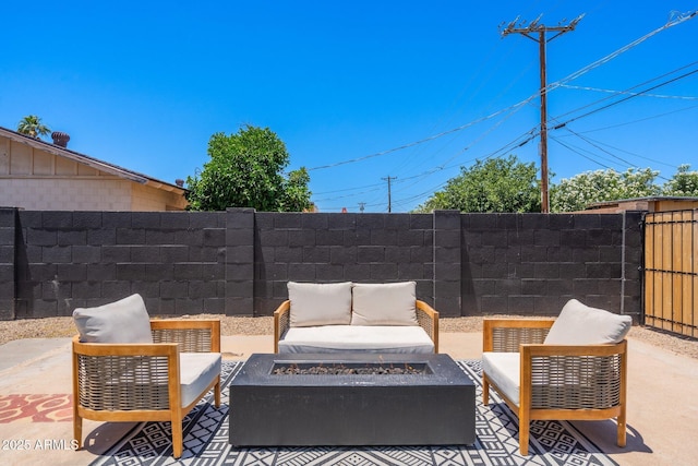 view of patio / terrace with an outdoor living space with a fire pit