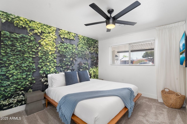 bedroom with ceiling fan and carpet floors