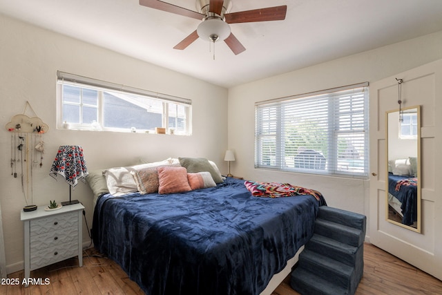 1712 E Montebello Ave, Phoenix, AZ 85016 - bedroom with wood finished floors, multiple windows, and ceiling fan