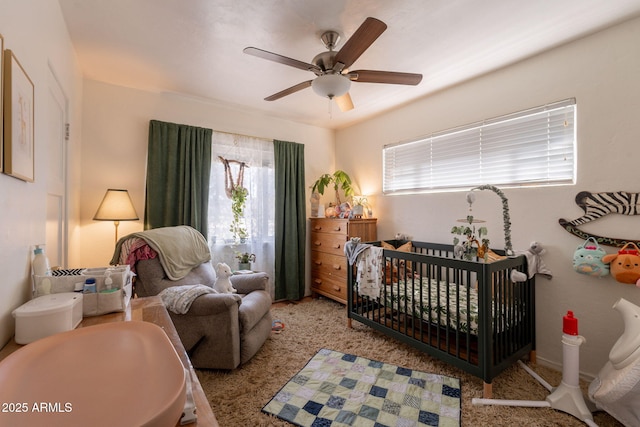 1712 E Montebello Ave, Phoenix, AZ 85016 - bedroom featuring a crib, ceiling fan, and carpet floors