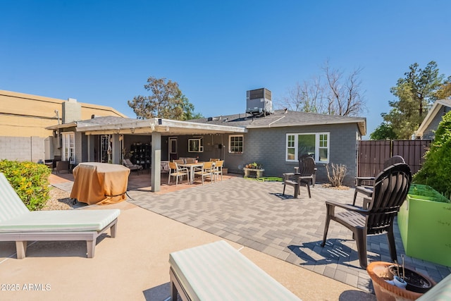 1712 E Montebello Ave, Phoenix, AZ 85016 - back of house featuring a patio area, outdoor dining space, fence, and central air condition unit