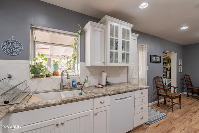 1712 E Montebello Ave, Phoenix, AZ 85016 - kitchen with a sink, white cabinets, light wood-type flooring, glass insert cabinets, and recessed lighting
