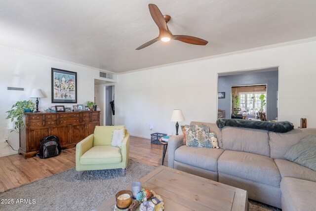 1712 E Montebello Ave, Phoenix, AZ 85016 - living room featuring wood finished floors, ceiling fan, crown molding, and baseboards