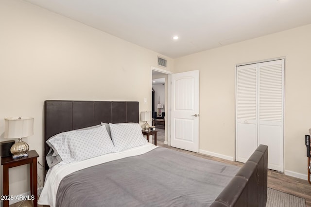 4832 E Cambridge Ave, Phoenix, AZ 85008 - bedroom with wood finished floors, a closet, baseboards, and recessed lighting