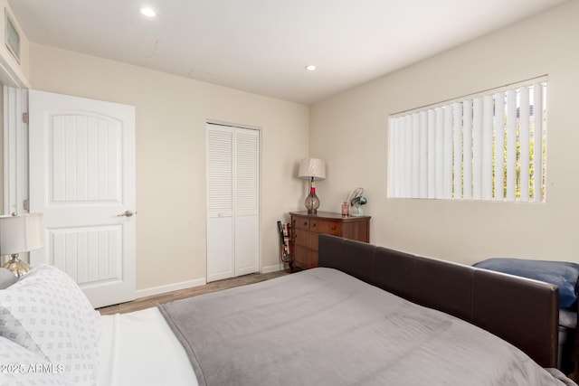 4832 E Cambridge Ave, Phoenix, AZ 85008 - bedroom with recessed lighting, wood finished floors, a closet, and baseboards