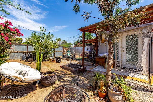4832 E Cambridge Ave, Phoenix, AZ 85008 - fenced backyard with an outdoor fire pit and a garden