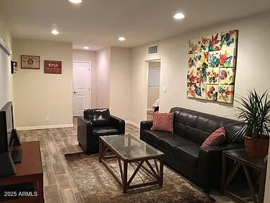 4832 E Cambridge Ave, Phoenix, AZ 85008 - living area with wood finished floors, recessed lighting, and baseboards